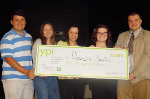 Steve Humphries of YPI Canada presents the $5,000 YPI award to the winning grade 10 students, Emalee Riddell, Summer Kennedy and Grace Cumpson, who accepted the award along with student council president Josh Keefe